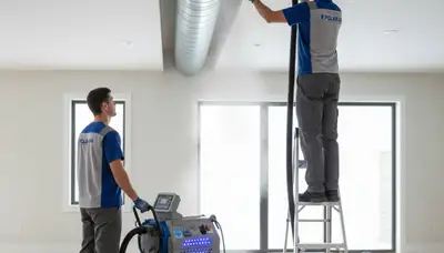 Technician cleaning air ducts for HVAC system in El Paso, TX by Five Star Cooling